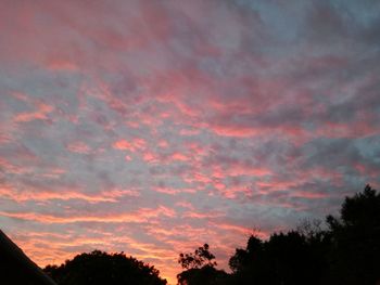 Low angle view of dramatic sky during sunset