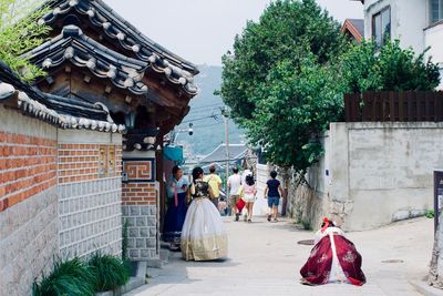 Group of people walking outside building