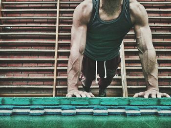 Low section of man exercising