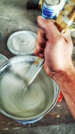 Close-up of cropped hand holding glass