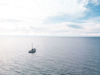 Boat in sea against sky