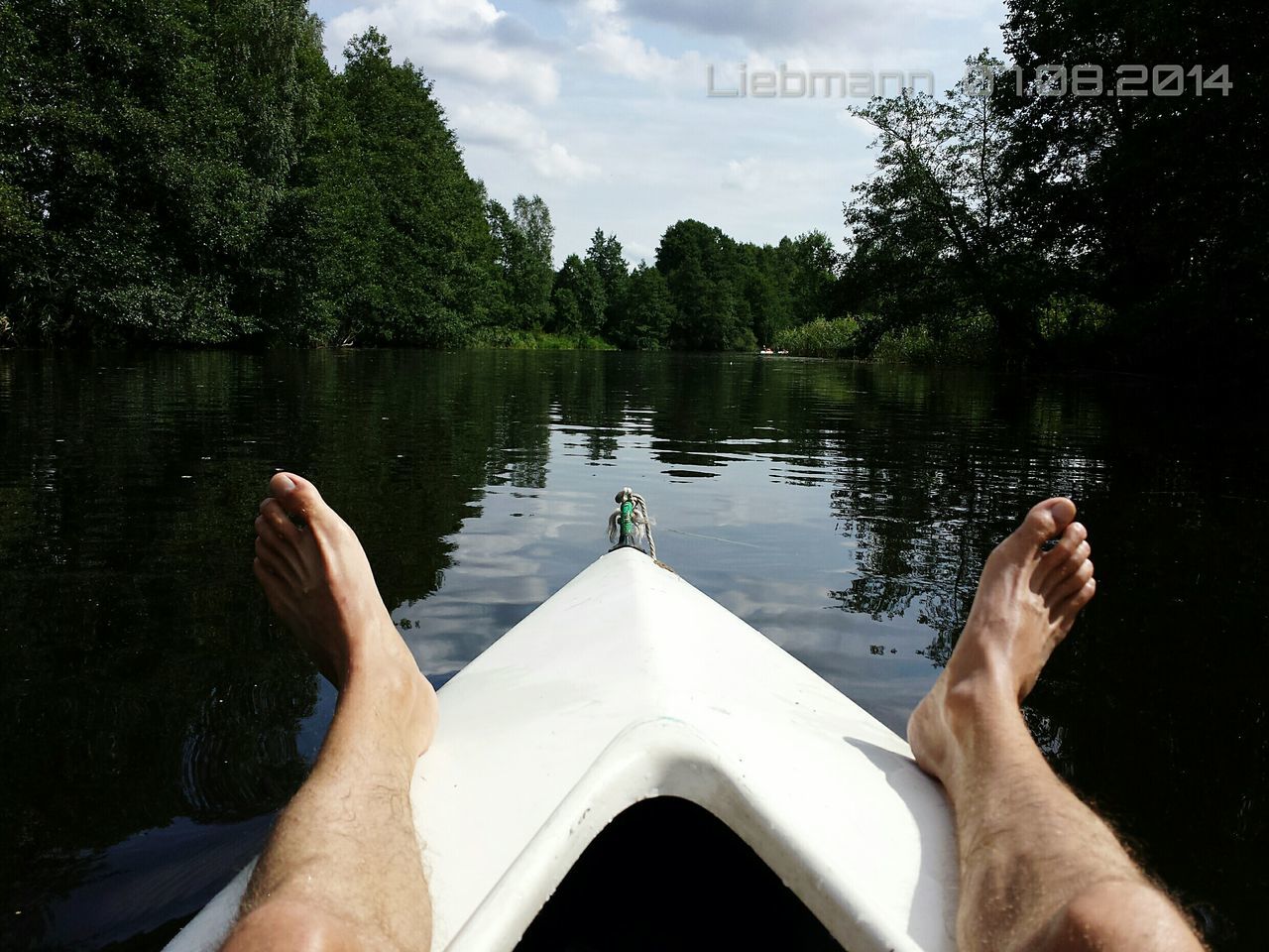 personal perspective, low section, person, water, part of, leisure activity, lifestyles, tree, sky, cropped, transportation, barefoot, lake, nautical vessel, relaxation, human foot