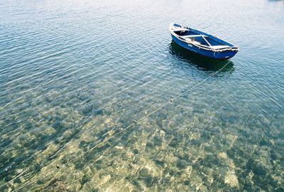 High angle view of boat moored in water