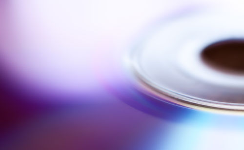 Close-up of coffee cup against blue background