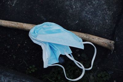 High angle view of blue umbrella on wood in yard