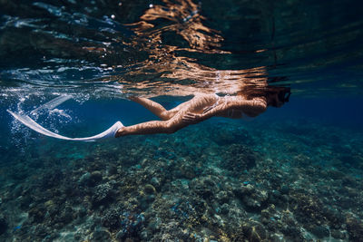 Man swimming in sea