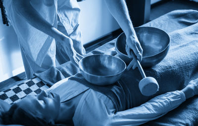 Midsection of woman holding bowl