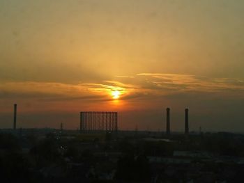 Silhouette of building at sunset