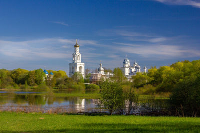 View of trees and buildings against sky