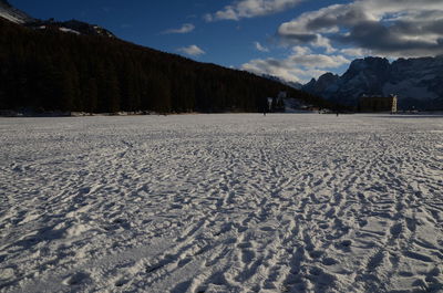 Scenic view of landscape against sky during winter