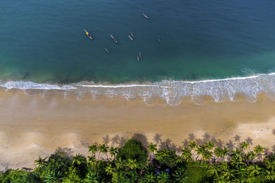 Aerial colorful bureh beach with fishing boats