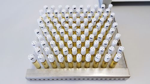 Close-up of chemicals in bottles arranged on table