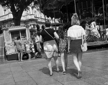 Full length of woman standing on bench