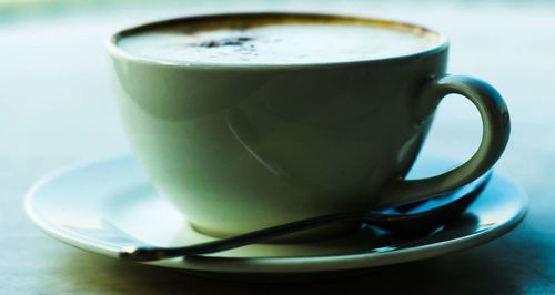 Close-up of coffee cup on table