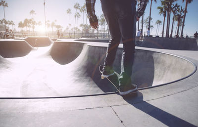 Low section of man skateboarding on skateboard