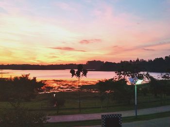 Scenic view of lake at sunset