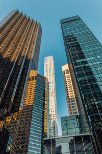 Low angle view of modern buildings against clear sky