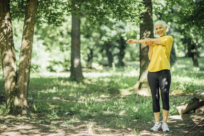 Senior woman stretching after a outdoor walking exercise