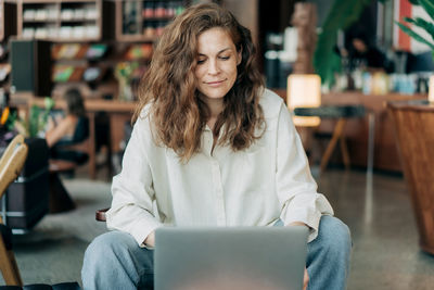 Young woman using mobile phone