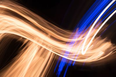 Close-up of light painting against black background