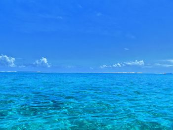 Scenic view of sea against blue sky