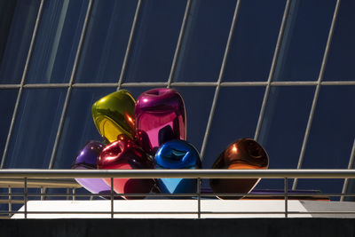 Low angle view of balloons on glass