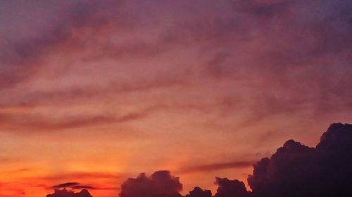 Low angle view of dramatic sky during sunset