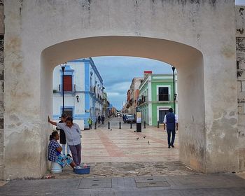 People on street amidst buildings