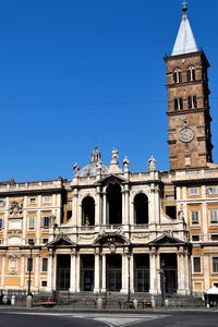 Low angle view of building against blue sky