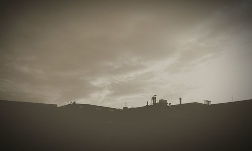 Scenic view of landscape against cloudy sky