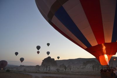 Hot air balloon flying over land