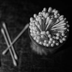 Close-up high angle view of cotton buds on table