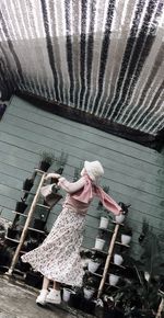 High angle view of woman holding umbrella