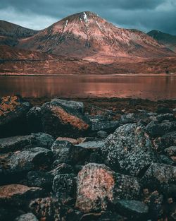 Scenic view of lake against mountain range