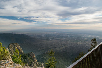 Scenic view of mountains against cloudy sky