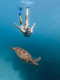 Woman swimming in sea