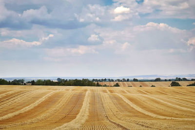 View of rolling landscape against sky