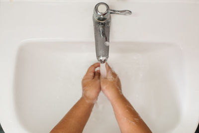 Midsection of woman in bathtub