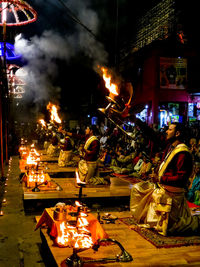 View of lit candles at night