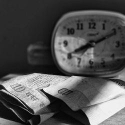 Close-up of clock on table