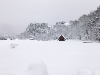Scenic view of frozen mountain against sky