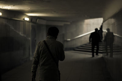 Rear view of man in tunnel