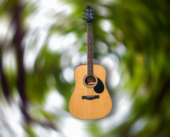 Close-up of guitar against blurred background