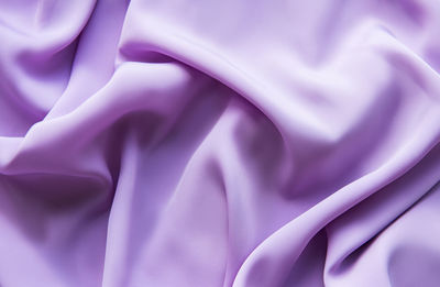 Beautiful smooth elegant violet purple satin silk, fabric texture, abstract background