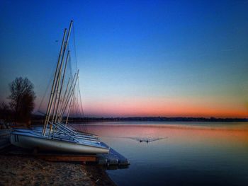 Scenic view of calm lake at sunset