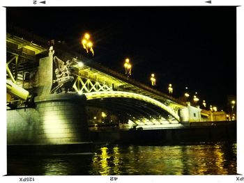 Bridge over river at night