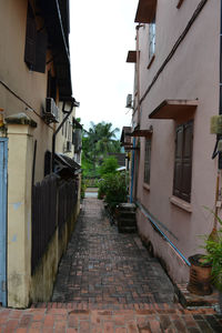 Narrow alley amidst buildings in city