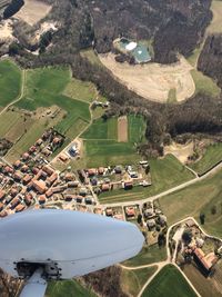 High angle view of landscape seen through airplane