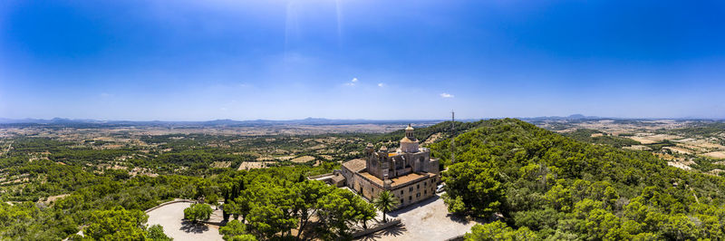 High angle view of trees and buildings against sky