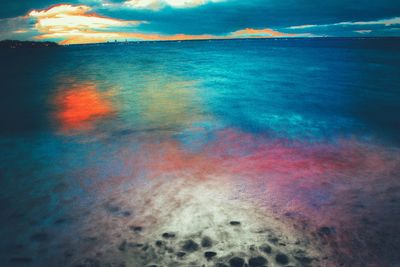 Scenic view of sea against dramatic sky